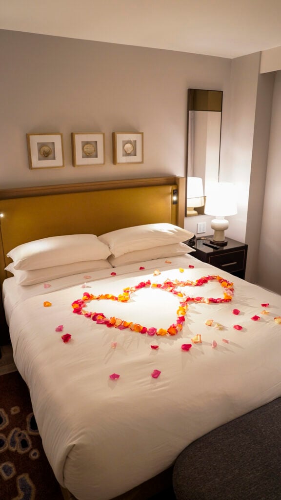 Bed with rose petals at the Breakers in Long Beach, California.