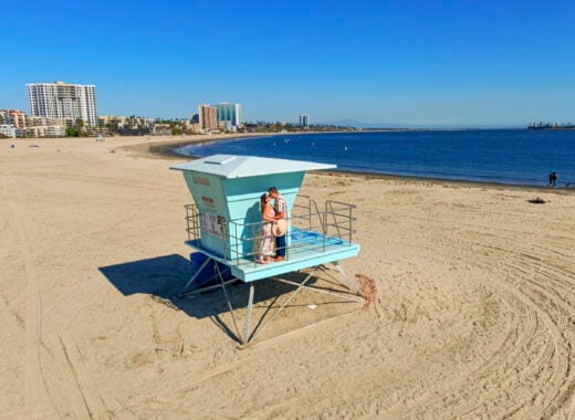 Couple on a lifeguard stand in Long Beach, California.