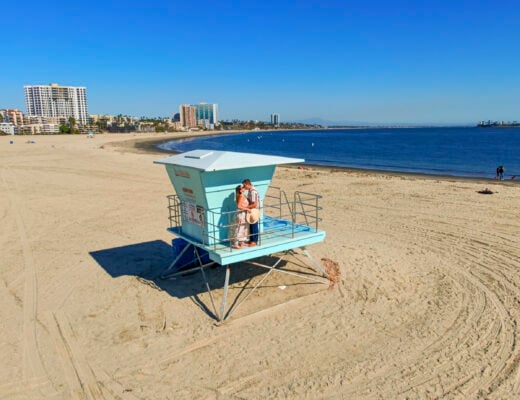 Couple on a lifeguard stand in Long Beach, California.