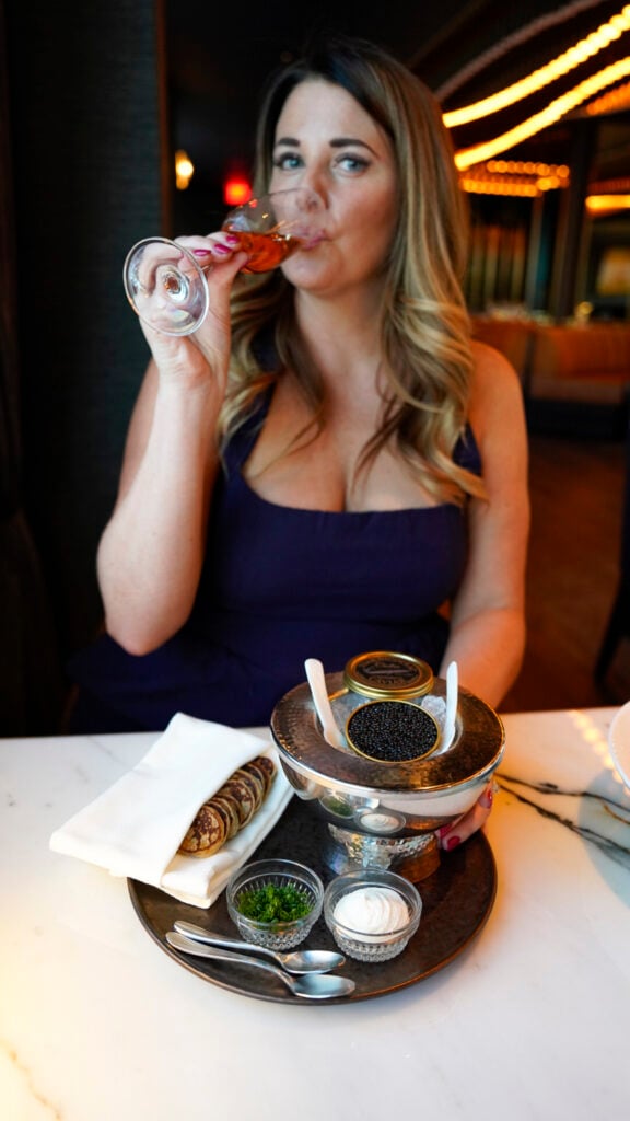 Women having champagne and caviar at Skyroom in the Fairmont Breakers Hotel in Long Beach, California.