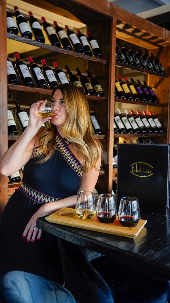 Woman drinking a wine tasting in Long Beach, California.