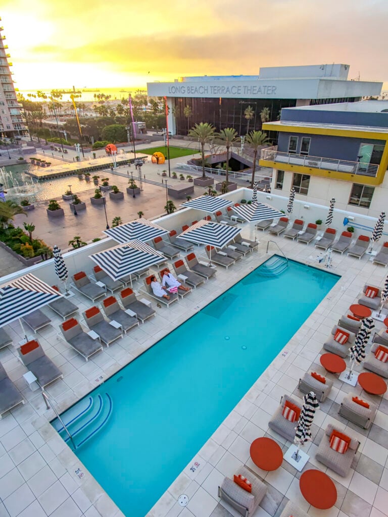 Couple at the pool at the Fairmont Breakers Hotel in Long Beach, California.