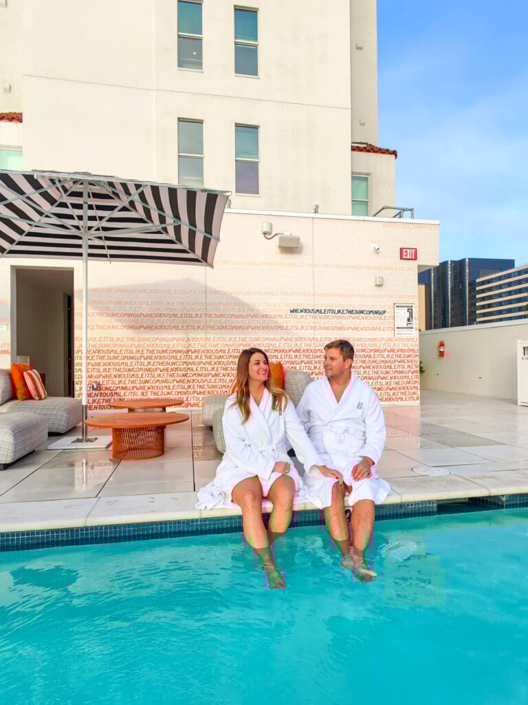 Couple at the pool at the Fairmont Breakers Hotel in Long Beach, California.