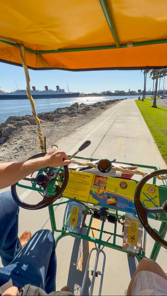 Couple on a surrey bike in Long Beach.