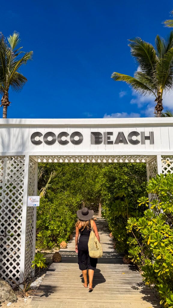 Woman walking into COCO Beach in St. Martin.