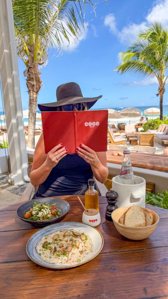 Woman dining at COCO Beach in St. Martin.