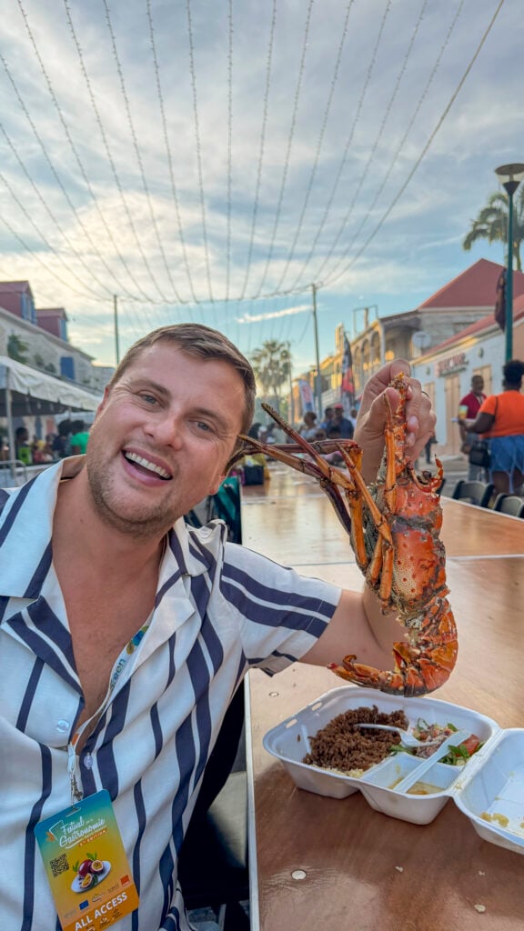 Man with a lobster in St. Martin.