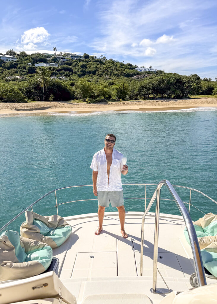 Man on a boat at Happy Bay Beach in St. Martin.
