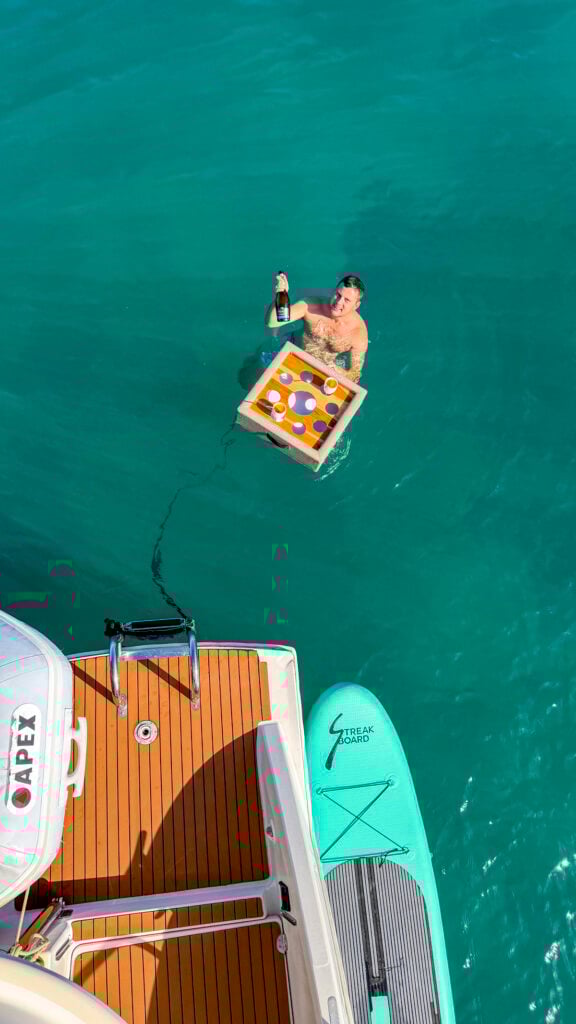 Man with a floating bar on a St. Martin private boat charter.