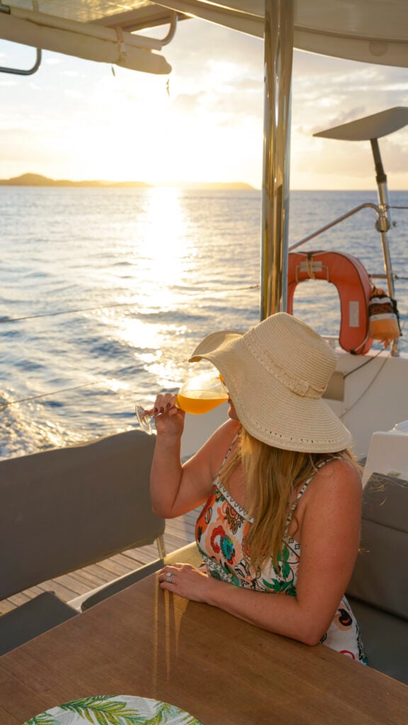 Women with a cocktail on a gourmet yacht in St. Martin.