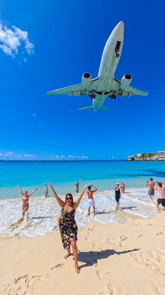 Planes landing over a tropical Caribbean beach in St Martin.