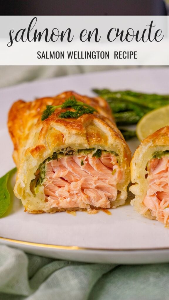 Salmon en Croute Salmon Wellington Recipe on a plate with asparagus.