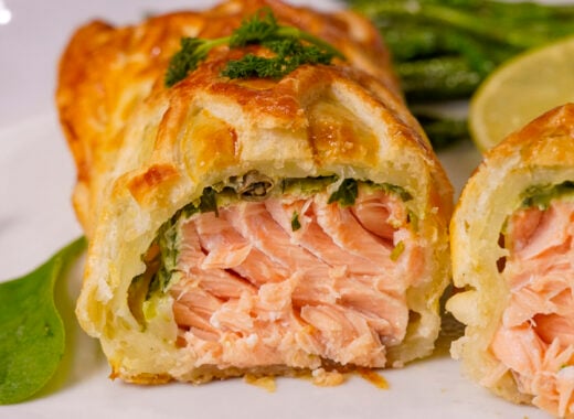 Salmon en Croute recipe sliced in half.