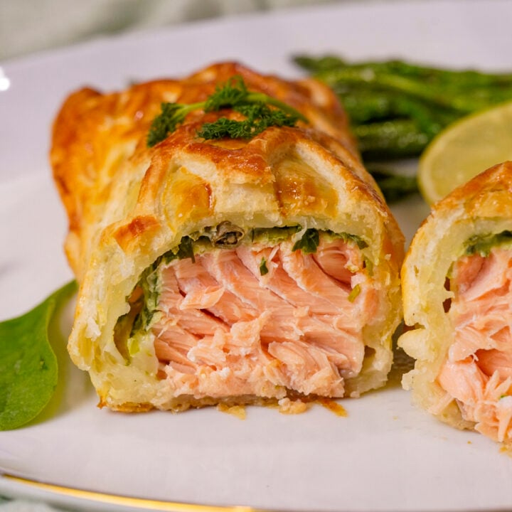 Salmon en Croute recipe sliced in half.