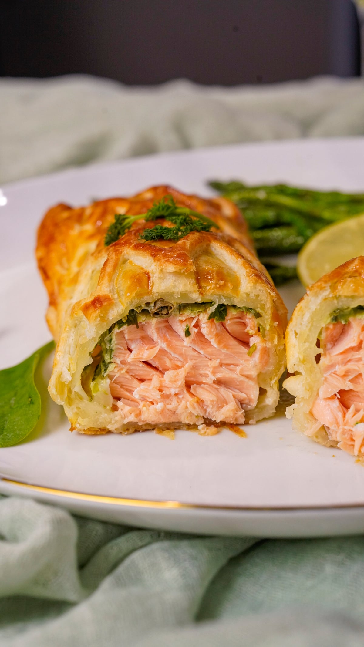 Salmon en Croute recipe sliced in half.