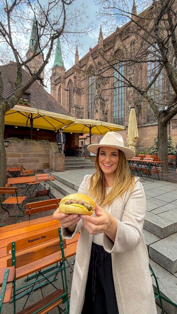 Woman with Nuremberg sausages in Nuremberg, Germany.