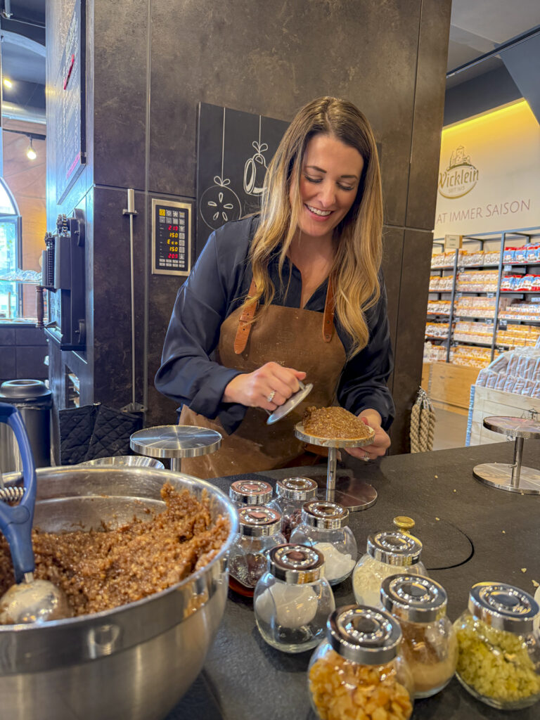 Woman at a gingerbread making class, one of the best things to do in Nuremberg, Germany.