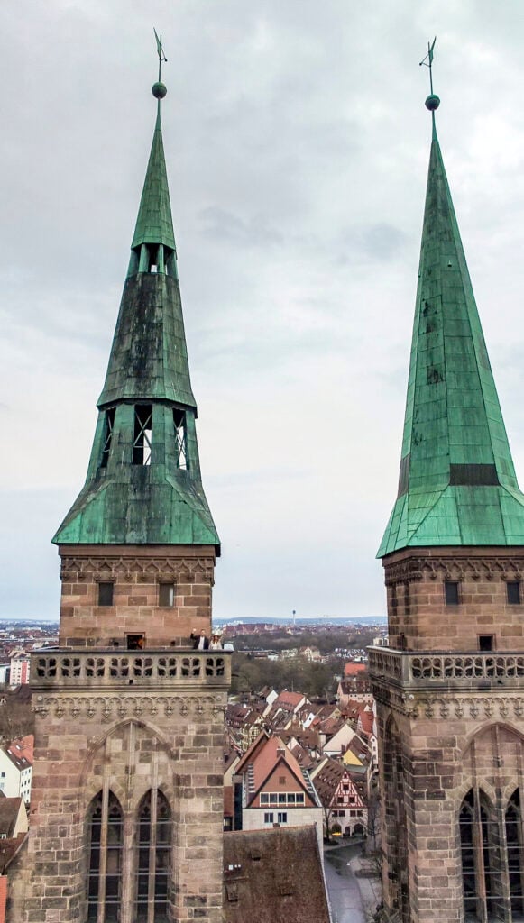 Couple on top of St. Sebald's tower in Nuremberg, Germany.