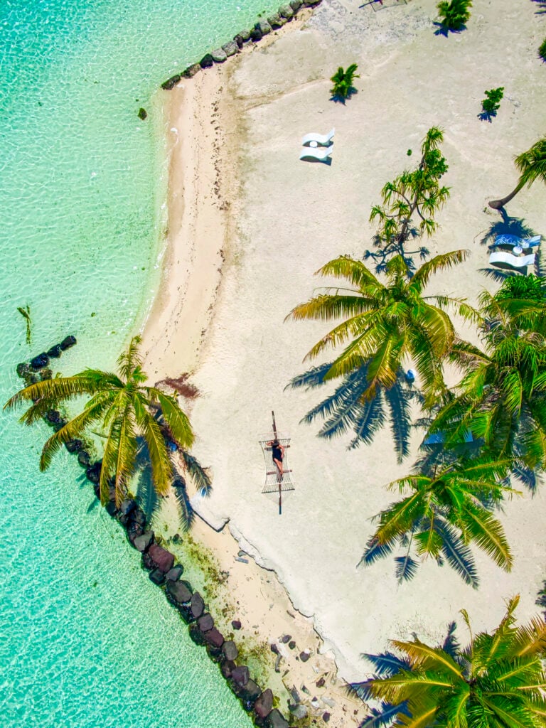 Woman in a hammock in Bora Bora, a stop on the Windstar Tahiti French Polynesia cruise.