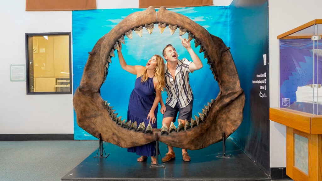 Couple inside a shark's mouth skull in Buena Park.