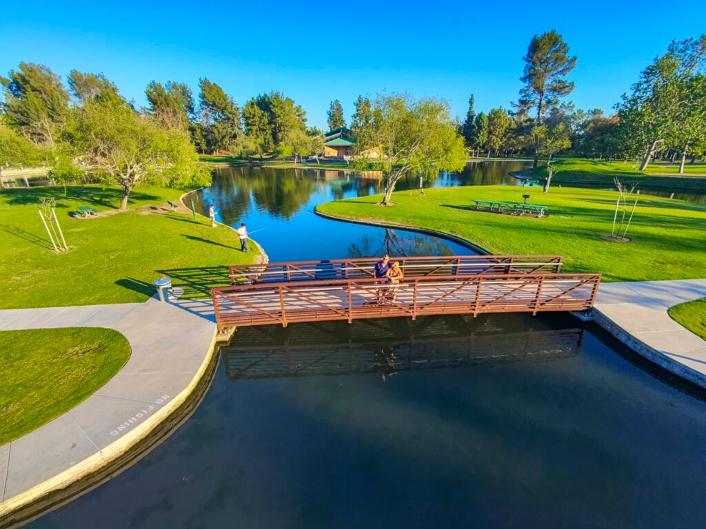 Couple on a bridge at a park in Buena Park, CA.