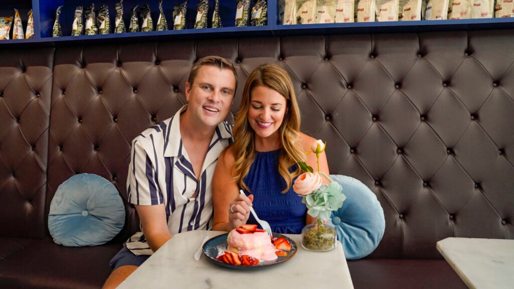 Couple dining on fluffy souffle pancakes in Buena Park.