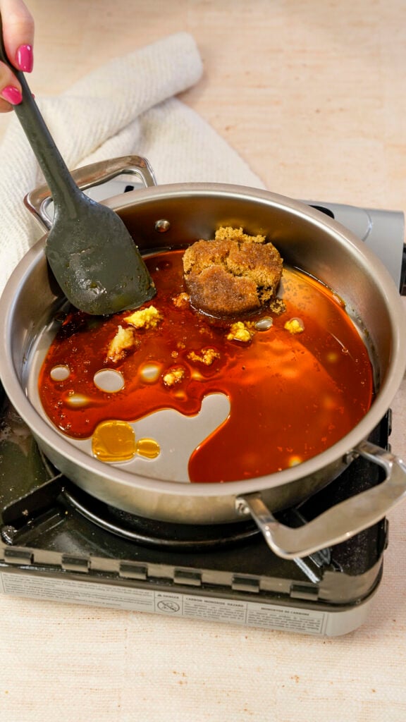 Ingredients in a pan for a Vietnamese caramelized salmon recipe.
