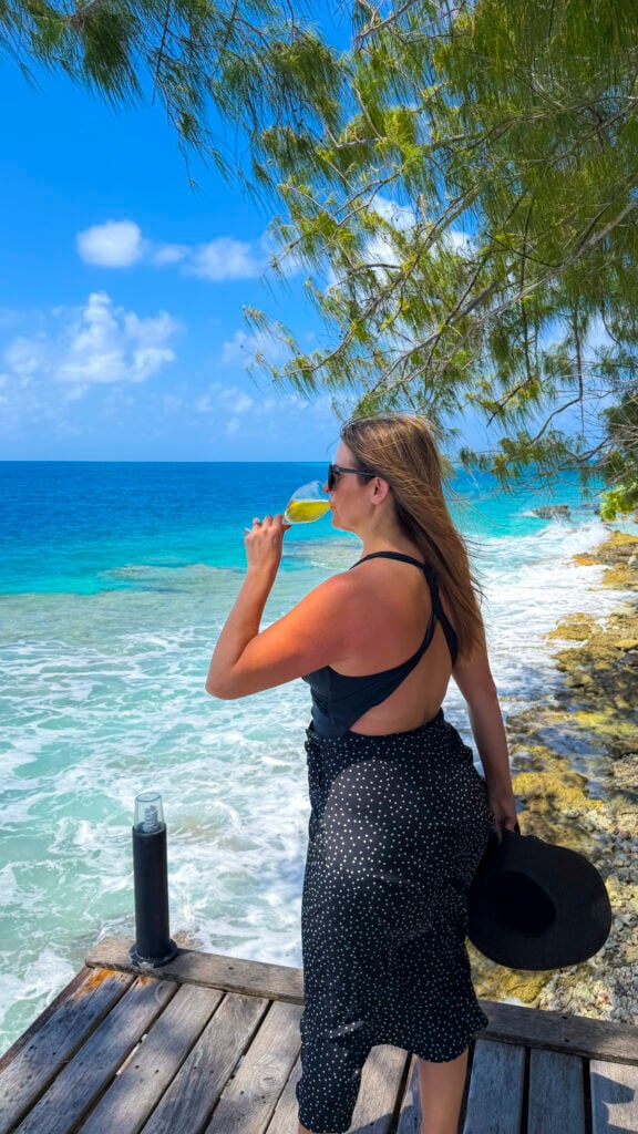 Woman drinking Tahiti Wine in Rangiroa, a stop on the Windstar Tahiti French Polynesia cruise.