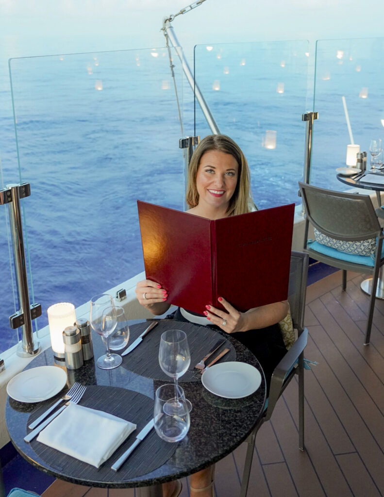 Woman dining at Candles on the Windstar Tahiti French Polynesia cruise.