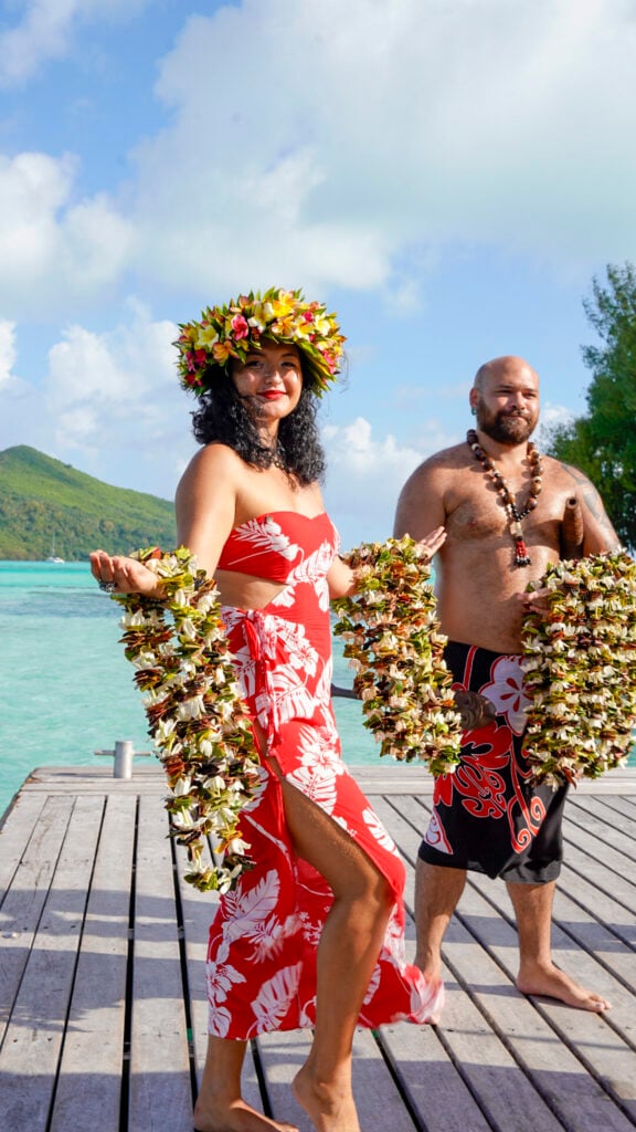 Woman with leis in Bora Bora, a stop on the Windstar Tahiti French Polynesia cruise.