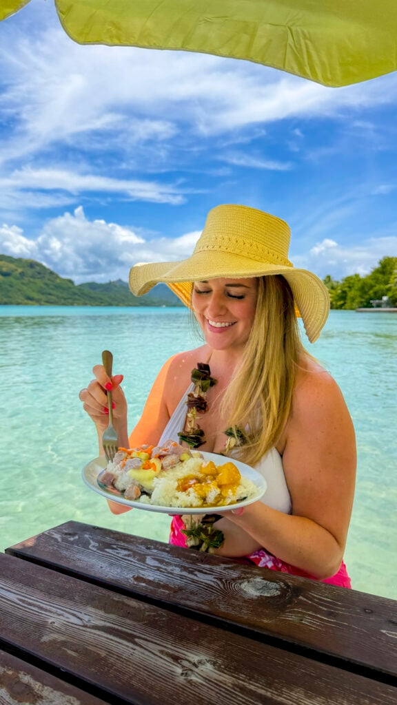 A woman eating in Huahine, a stop on the Windstar Tahiti French Polynesia cruise.