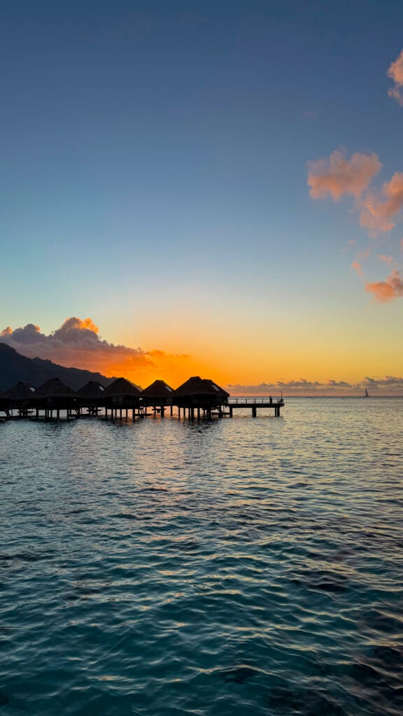 Moorea bungalows at sunset.