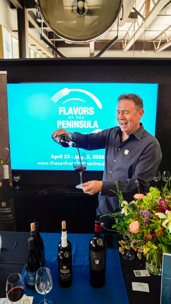 Man pouring wine at the San Francisco Peninsula Flavors of the Peninsula event.