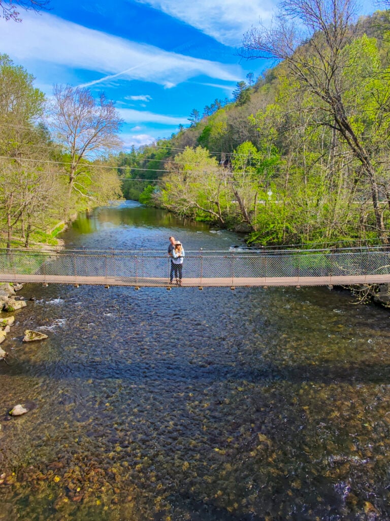 Couple on a bridge in the smoky mountains.