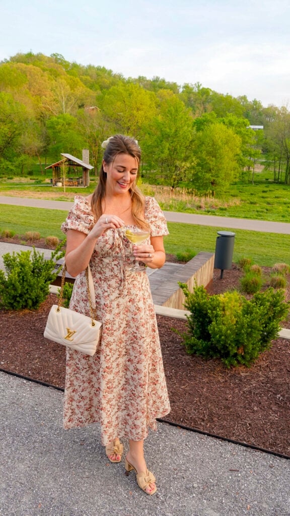 Woman with a cocktail at January Restaurant at Southall, a Nashville Michelin restaurant.