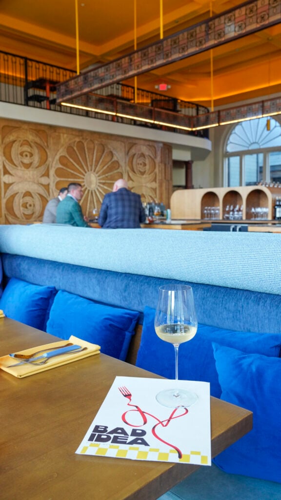 A glass of wine inside Bad Idea, a Nashville Michelin restaurant.