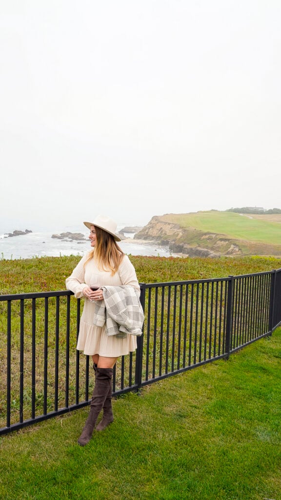 Woman visiting the Ritz Carlton Half Moon Bay, one of the best things to do in Pescadero in the San Francisco Peninsula.