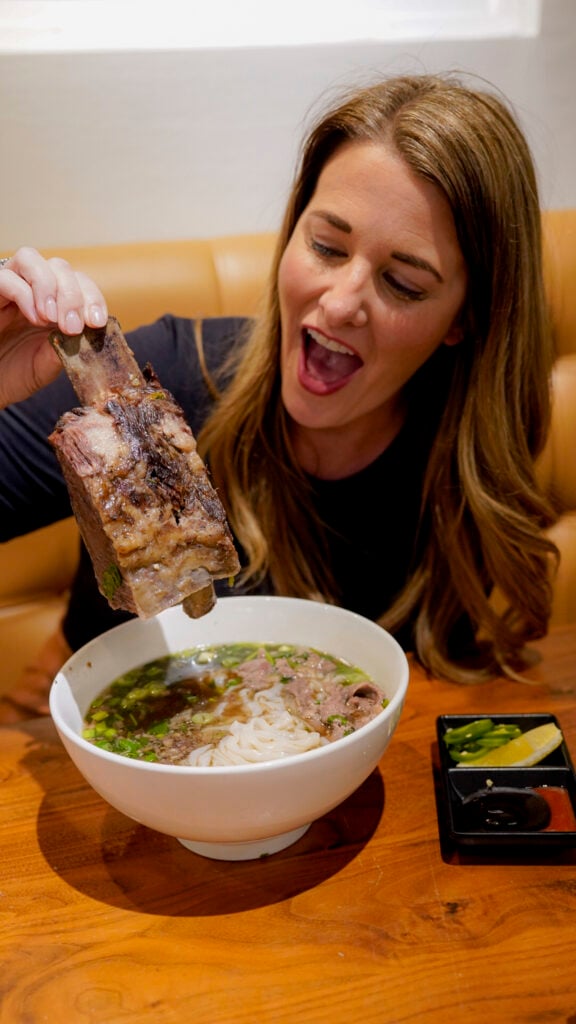 Women eating beef short rib pho in the San Francisco Peninsula.