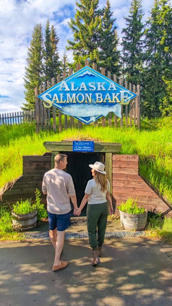 Couple outside of the Greak Alaska Salmon Bake in Fairbanks Alaska in summer.