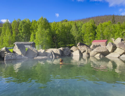 Woman relaxing at the Chena Hot Springs in Fairbanks Alaska in summer.
