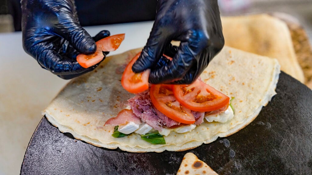 Preparing a crepe at The Creperie, one of the best restaurants in Fairbanks Alaska.