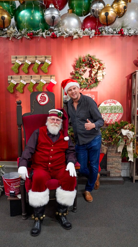 Man with Santa at the Santa Claus House in North Pole in Fairbanks Alaska in summer.