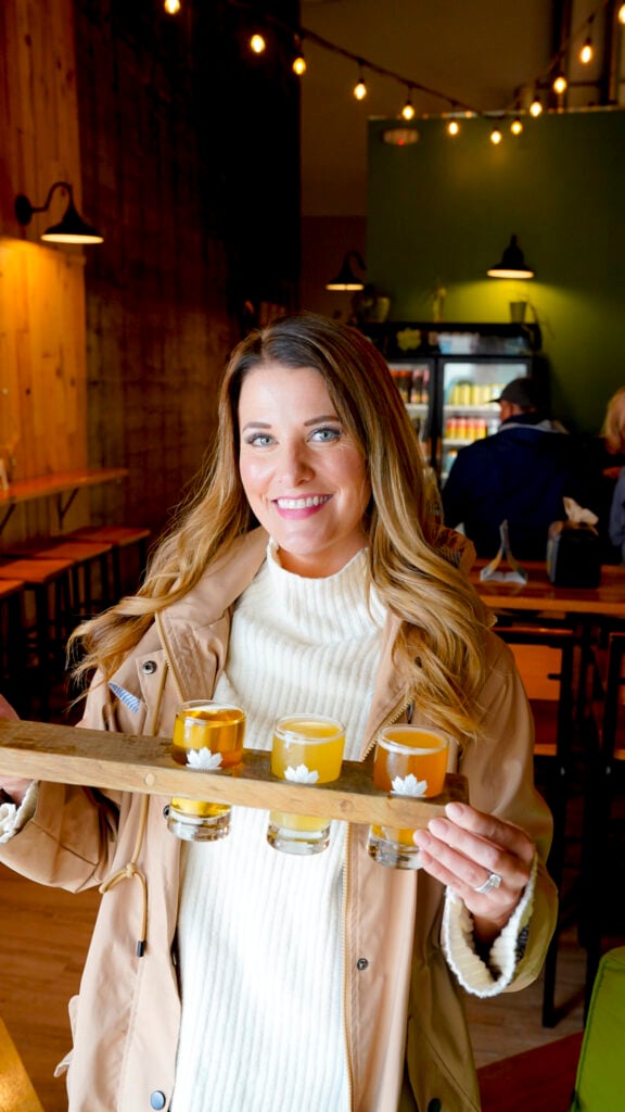Women with a beer flight tasting - Things to do in Juneau Alaska from a cruise ship.
