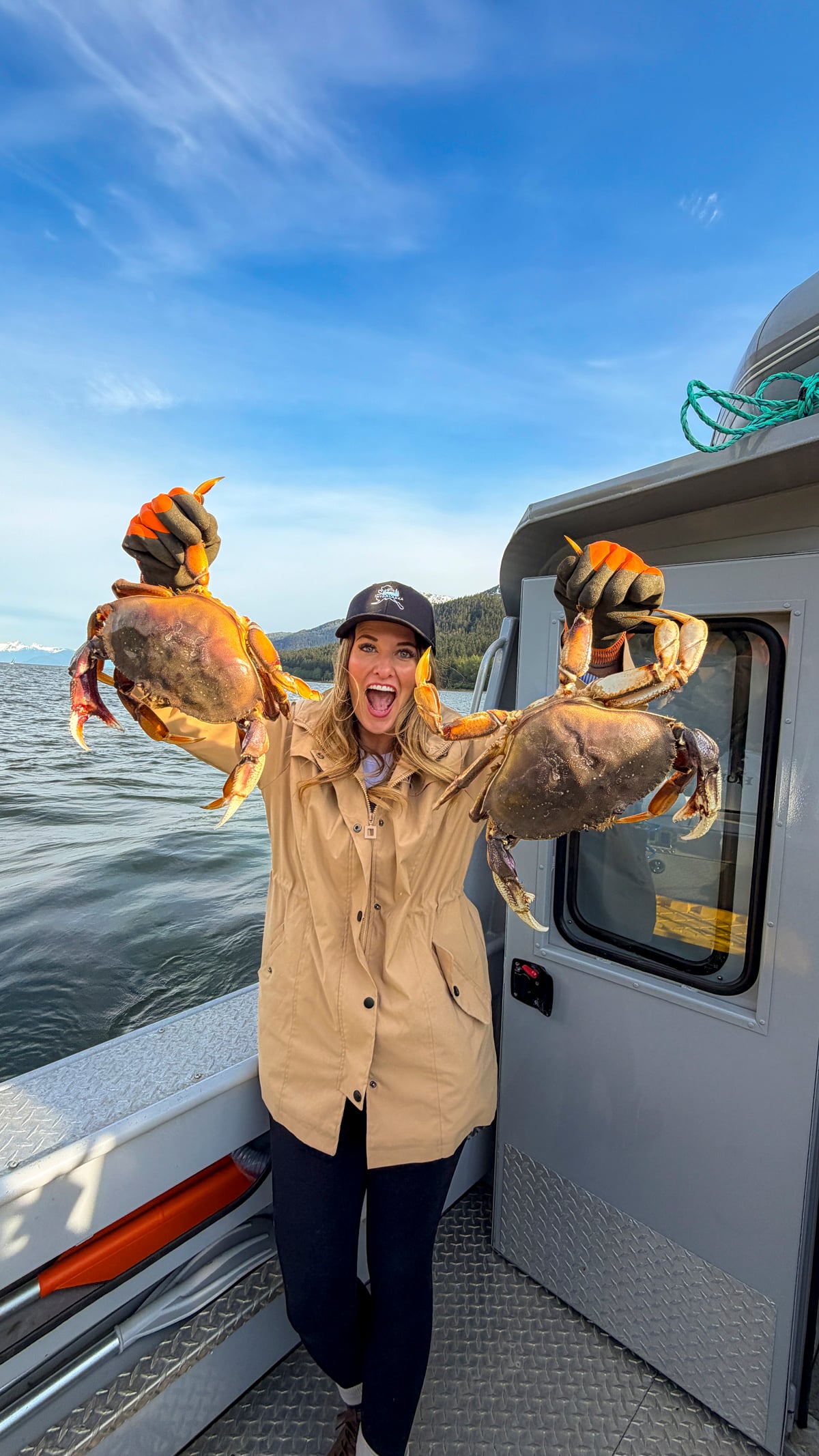 Woman holding crabs from the Into Alaska crabbing tour in Juneau, Alaska.
