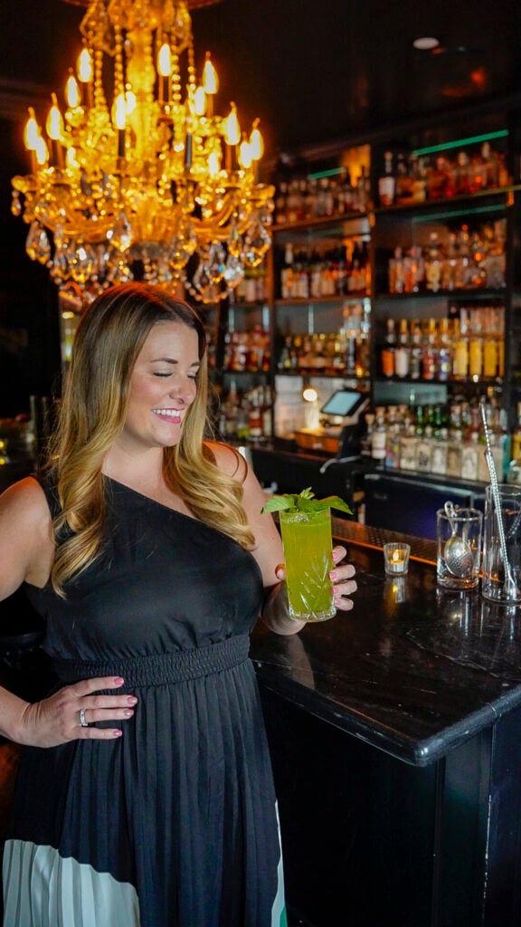 Woman with a cocktail from Death and Taxes one of the best restaurants and bars in Reno.